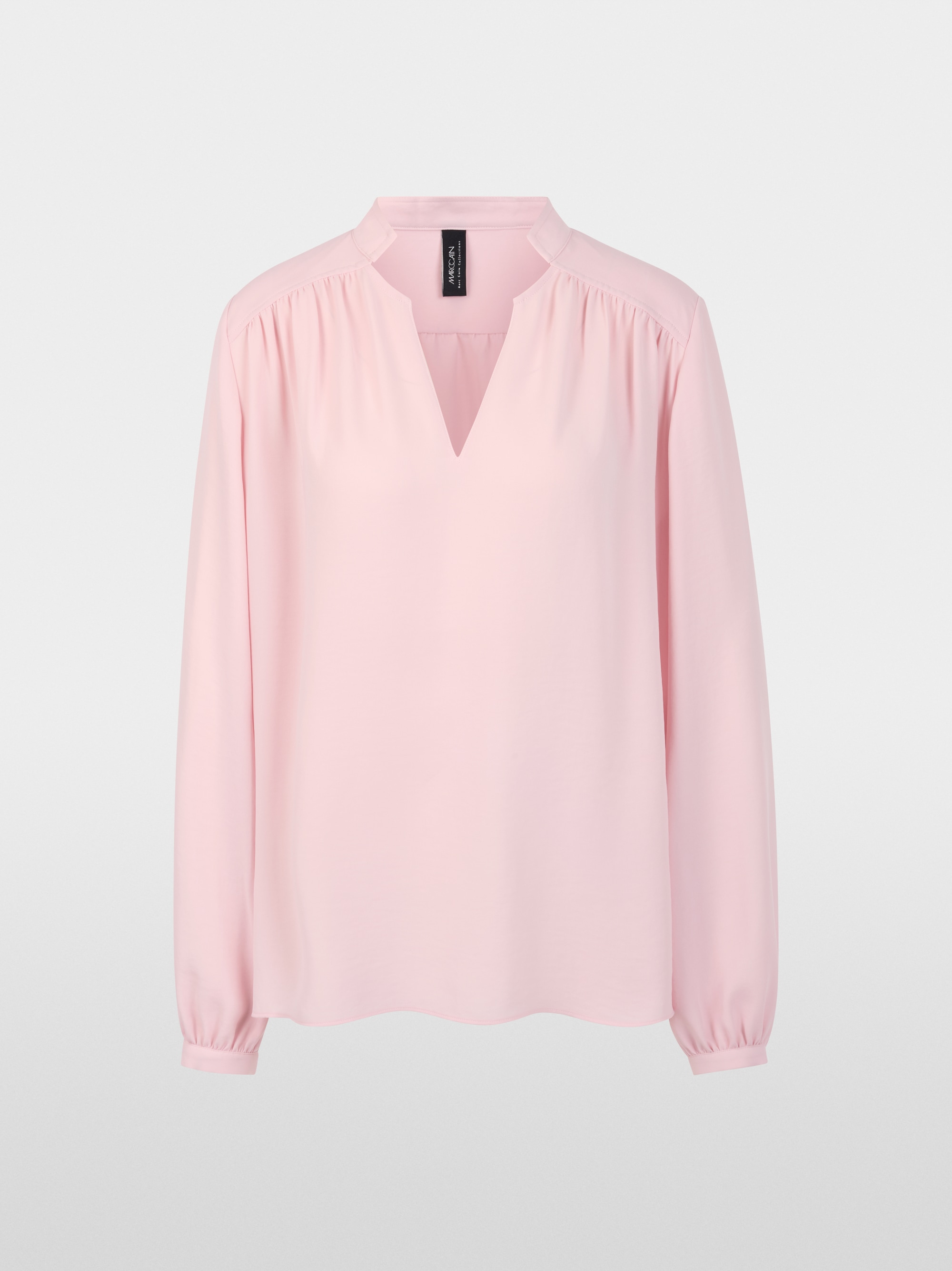 Flowing blouse with decorative button