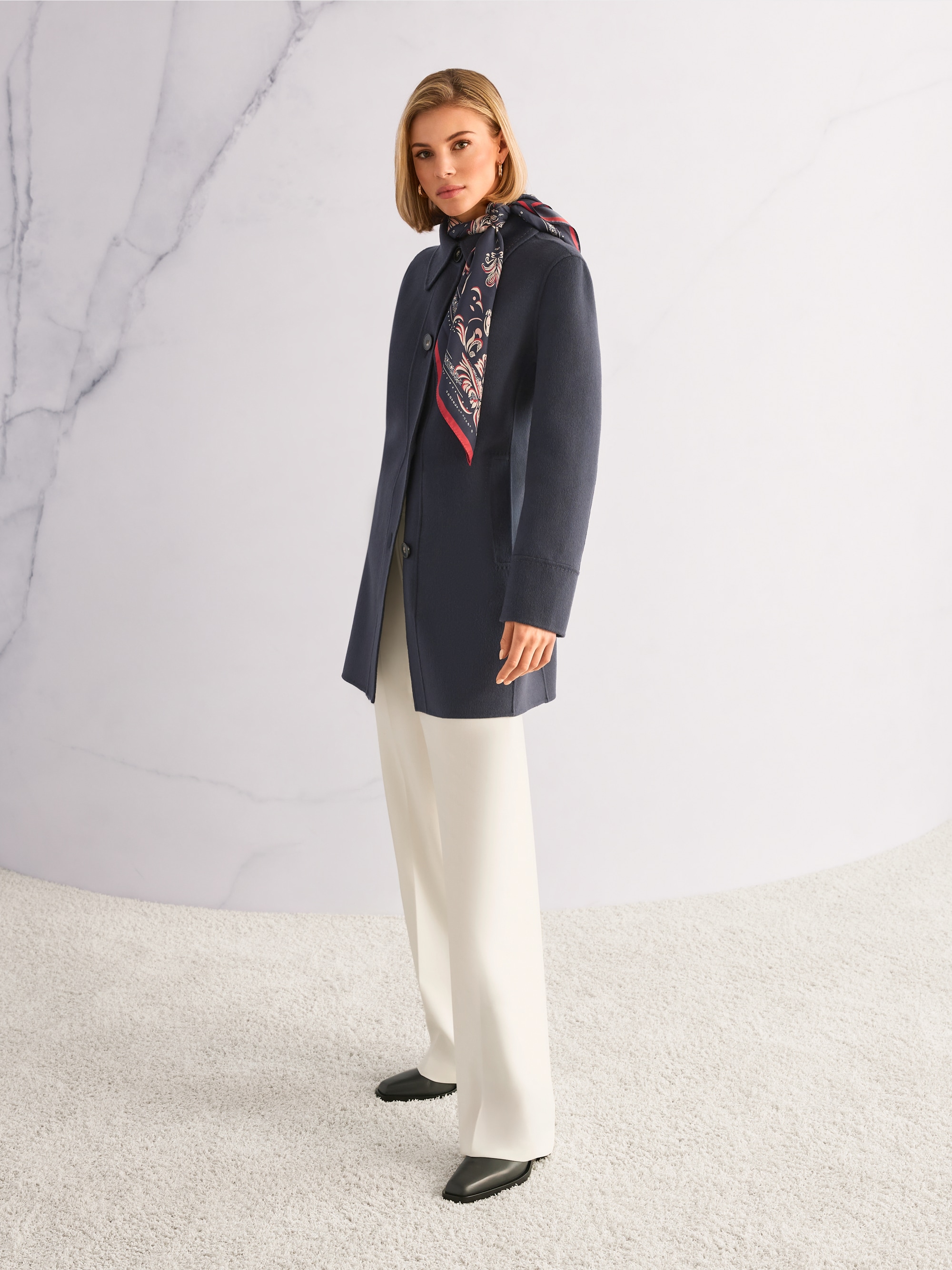 Wool coat with decorative stitching