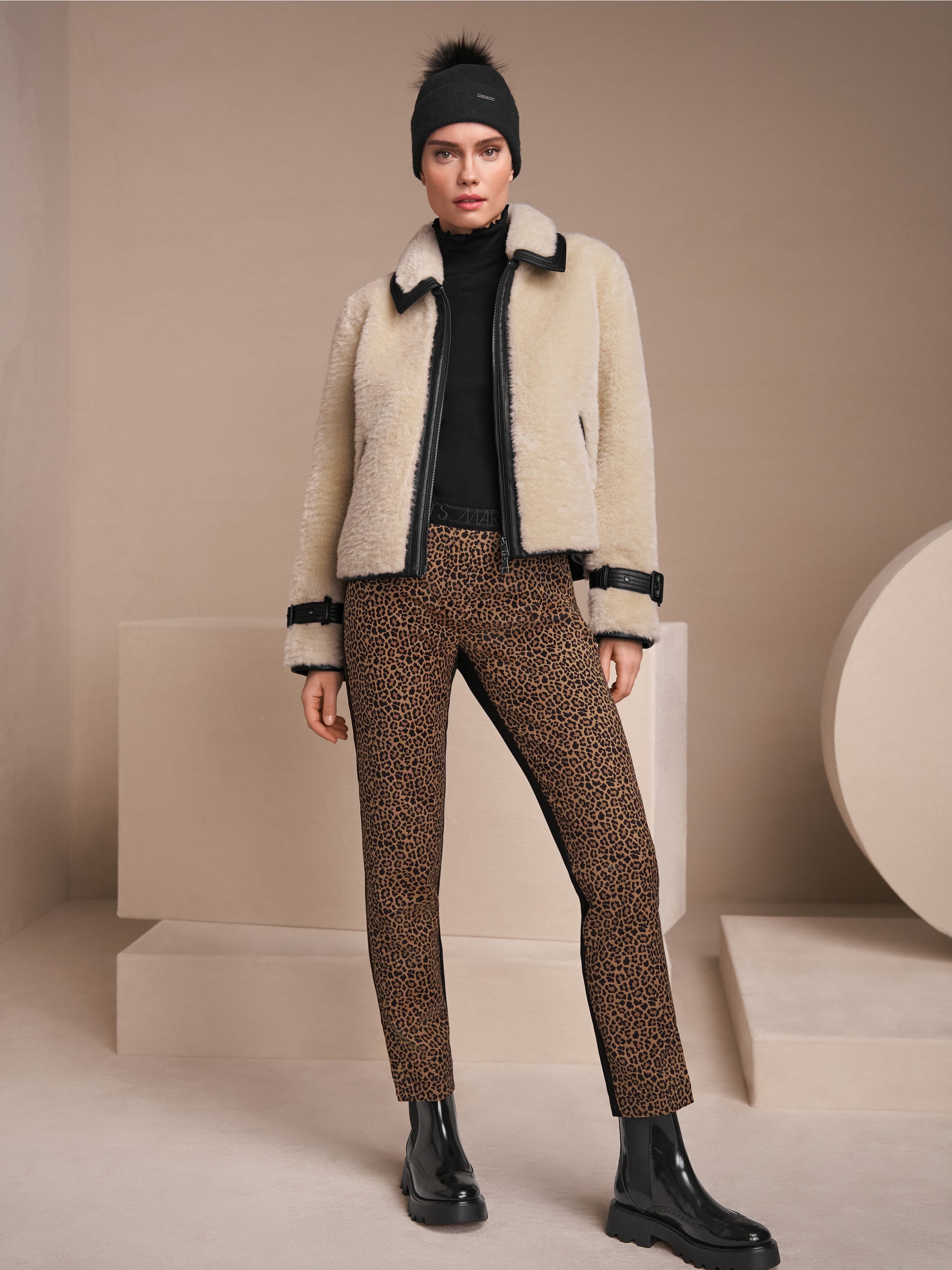 Faux fur jacket with strap detail