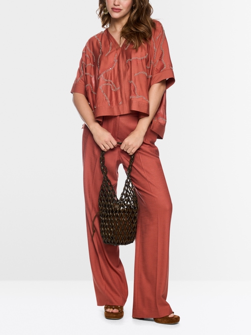 Flared blouse with embellishment