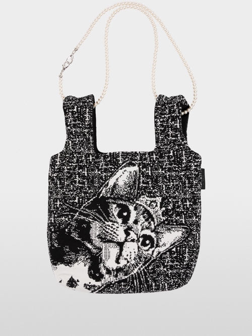 Reversible knitted bag with cat motif
