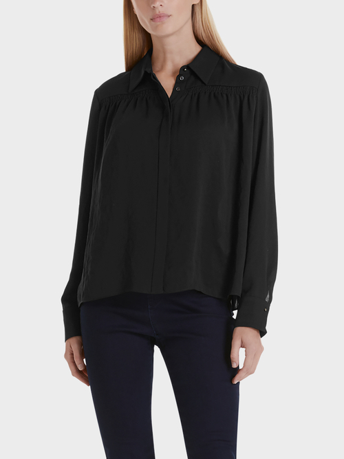 Blouse with smocked details