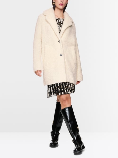 Manteau court bouclé tricoté en Allemagne