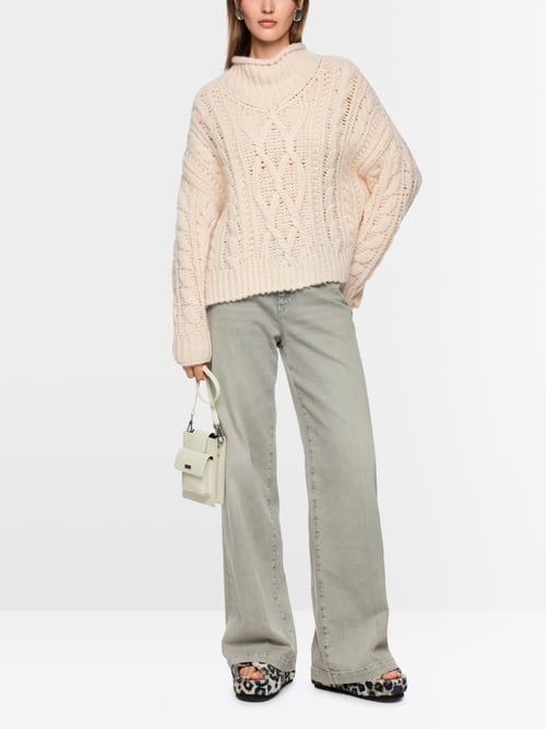Tricoté en Allemagne Pull à motif torsadé