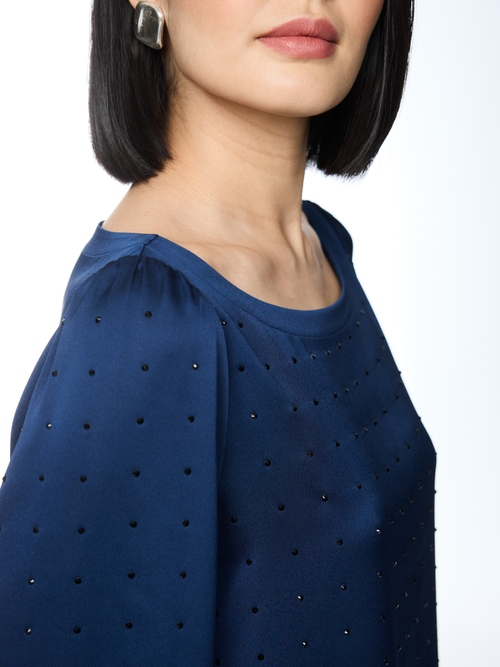 Loose-fitting blouse with rhinestones