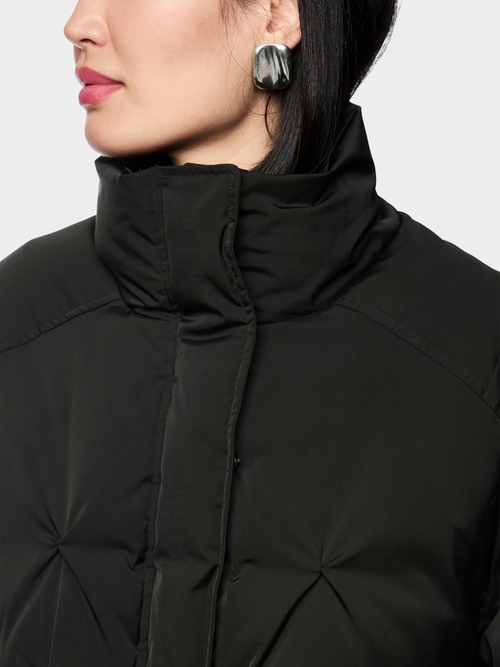 Veste matelassée en duvet avec bordure tricotée