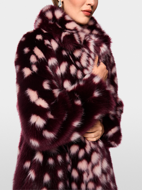 Coat with striking polka dot print