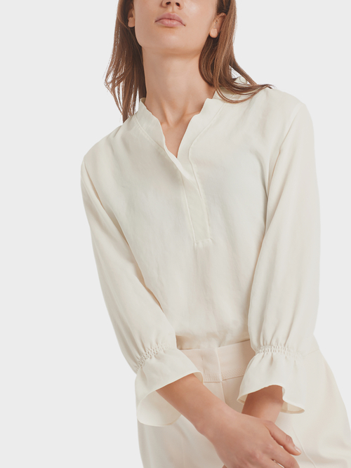 Blouse-style top with flounce details