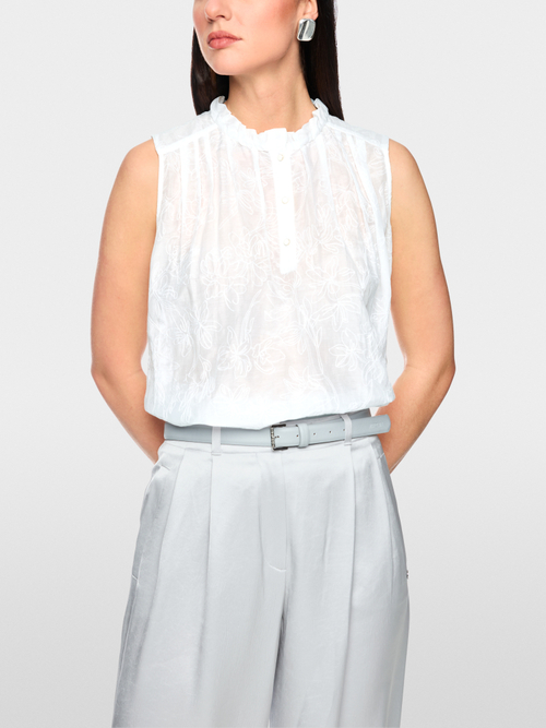 Top with ruffles & floral embroidery