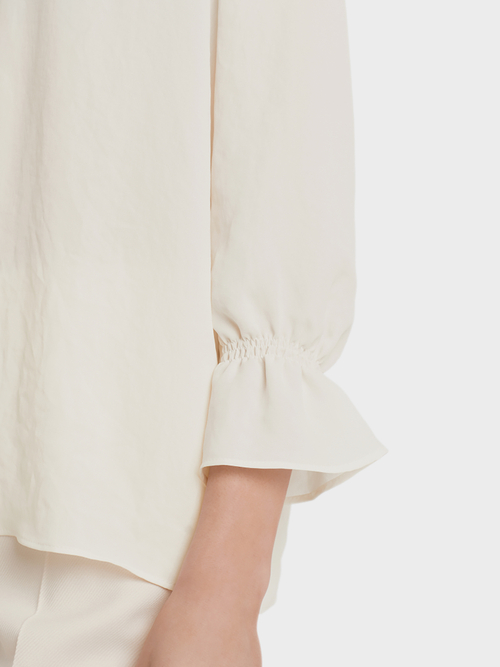 Blouse-style top with flounce details
