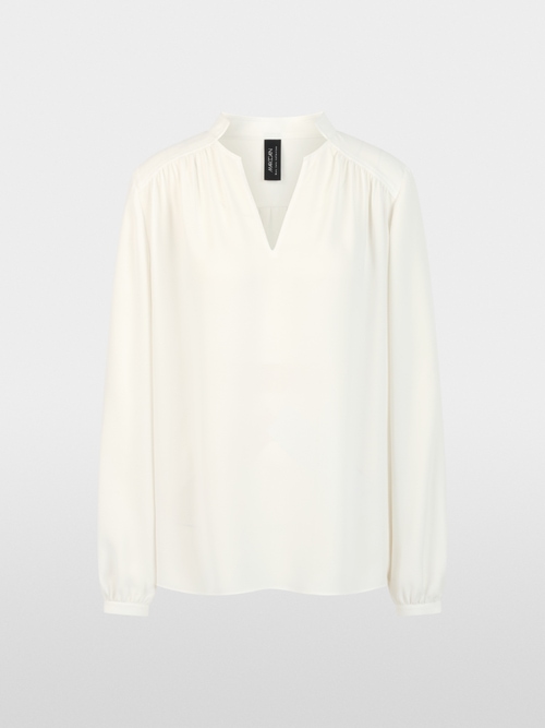 Flowing blouse with decorative button