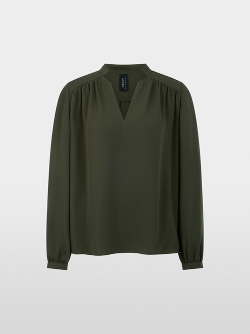 Flowing blouse with decorative button