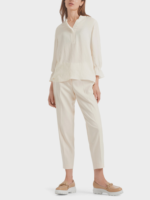 Blouse-style top with flounce details