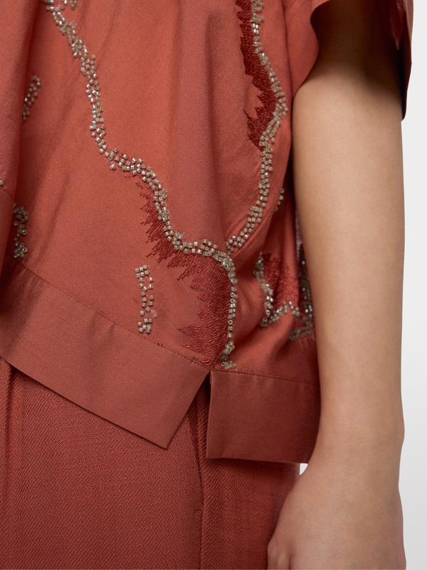 Flared blouse with embellishment