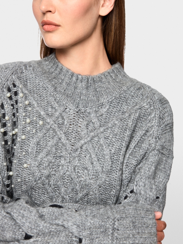 Cable-knit jumper with details