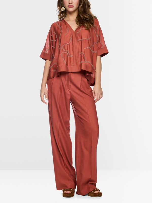 Flared blouse with embellishment