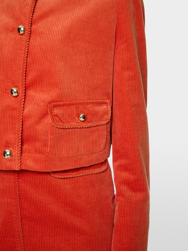 Short jacket with decorative buttons