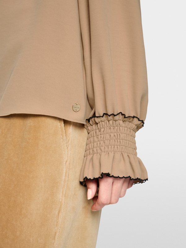 Loose-fitting blouse with smocking