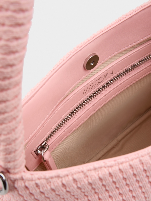 Handbag with knitted surface
