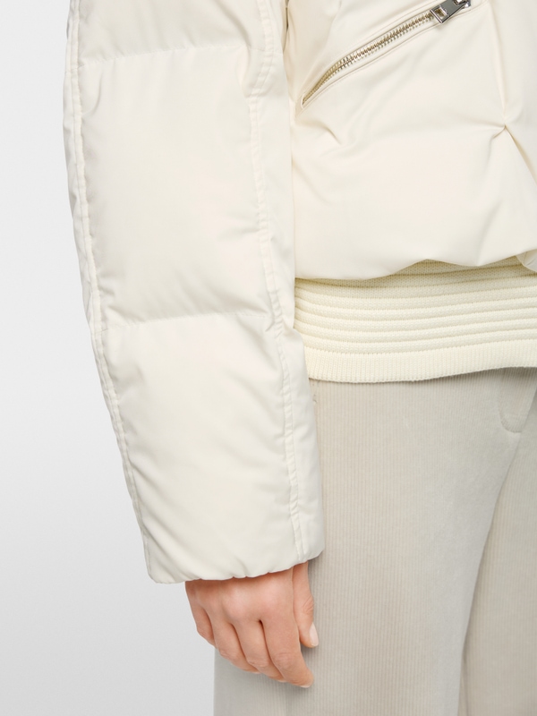 Quilted down jacket with knitted cuffs