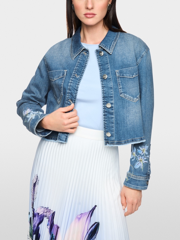 Denim jacket with floral print sleeves