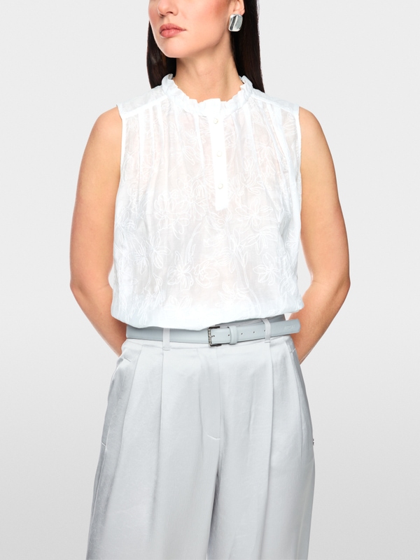 Top with ruffles & floral embroidery