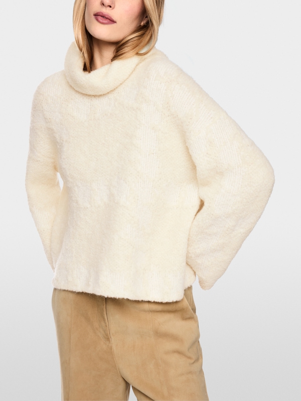 ‘Knitted in Germany’ turtleneck jumper