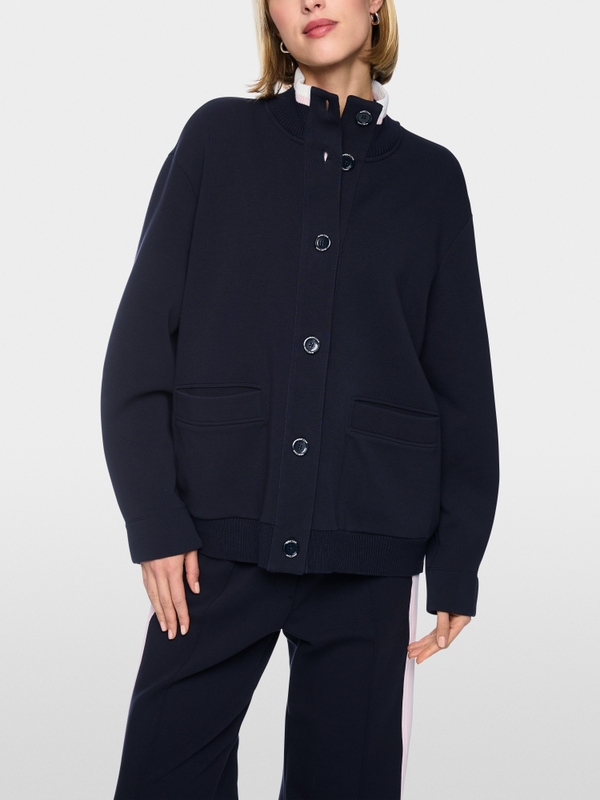 Jacket with knitted details