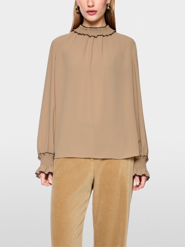 Loose-fitting blouse with smocking