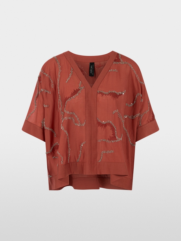 Flared blouse with embellishment