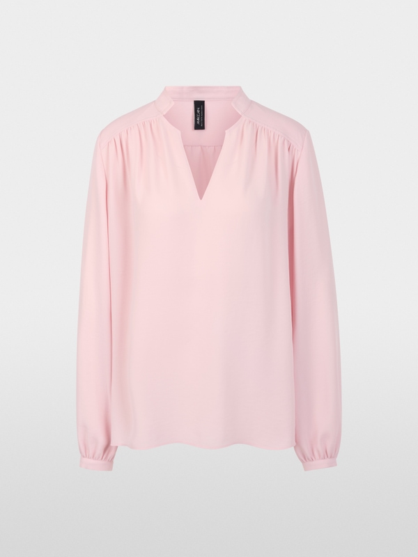 Flowing blouse with decorative button