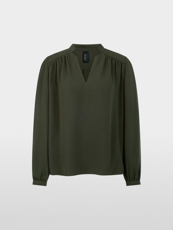 Flowing blouse with decorative button