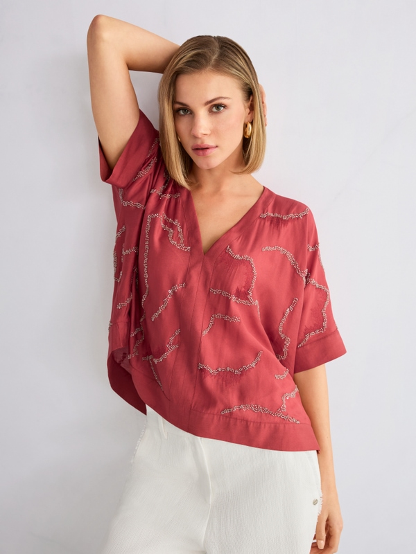 Flared blouse with embellishment