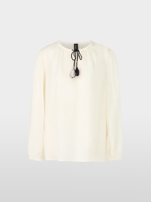 Delicate blouse with tassels